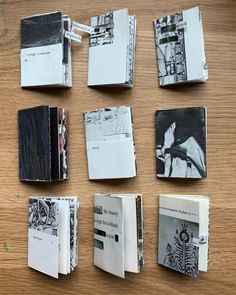 several different types of books are laid out on a wooden table with black and white photos