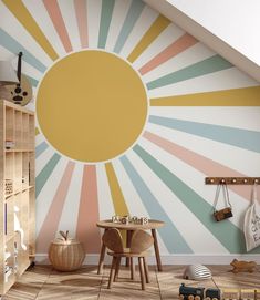 a child's room with sunburst painted on the wall and wooden furniture