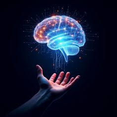 a person's hand holding up a glowing brain