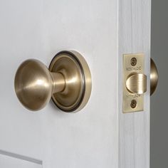 an open door with a brass handle on it