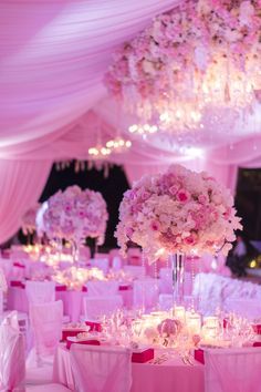 the tables are decorated with pink and white flowers