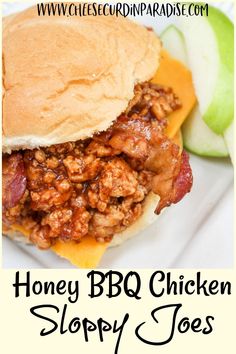 a close up of a sandwich on a plate with apples in the background and text that reads honey bbq chicken sloppy joes