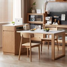 a table and chairs in a small room