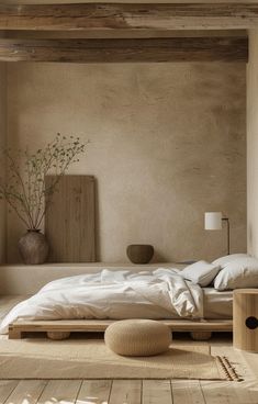 a bed sitting in a bedroom on top of a wooden floor