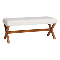 a wooden bench with a white upholstered seat