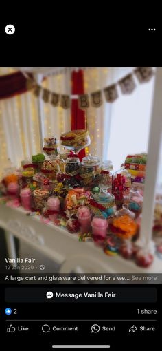 an image of a table with candles and candies on it that is being viewed from the bottom