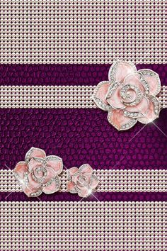 two pink roses on purple and white striped fabric with diamond brooches in the center