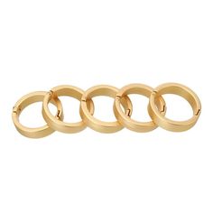 four gold rings on a white background