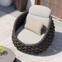 a wicker chair sitting on top of a patio