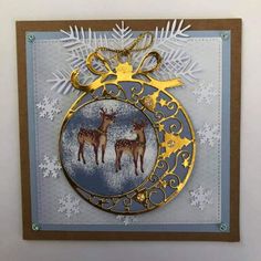 an ornament is hanging on the wall with snowflakes and reindeers