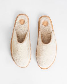 Lindquist's Ika house shoes have vachetta soles with a natural shearling footbed and full shearling upper lined with vachetta suede. Fluff forward. Their natural shearling is sourced from dense, curly hair sheep and has a ½ inch nap. Finished with a natural rubber non slip sole. Slipper Shoe Silhouette, Walking On A Dream, Statement Socks, House Shoes, Our House, Monogram Initials, Winter Outfit, Vegetable Tanned Leather, Walk On