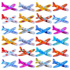 many different types of toy airplanes on a white background