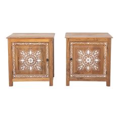 two wooden side tables with carved designs on them