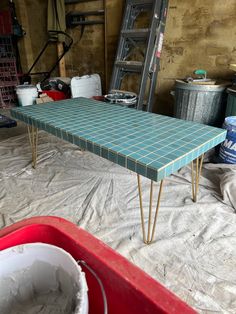 a table that has some hairpinks on top of it in a room with other items