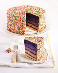 there is a cake with sprinkles on the top and one slice missing