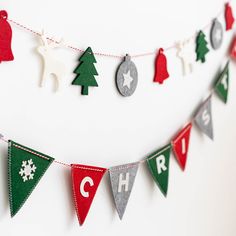 a garland with christmas decorations hanging from it