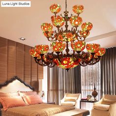 a chandelier hanging from the ceiling in a bedroom