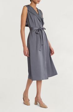 Satin accents lend casual elegance to a modern take on the classic shirtdress silhouette. 47" length (size Medium) True wrap style Surplice V-neck; shawl collar Sleeveless Unlined 100% polyester Machine wash, dry flat Imported Classic Shirt Dress, Sleeveless Shirt Dress, The Cove, Back Stretches, Illusion Dress, Maggy London, Stretch Satin, Shirtdress, Casual Elegance