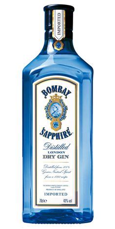 a bottle of blue liquid with an emblem on the top and bottom, sitting in front of a white background