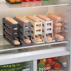 an open refrigerator filled with eggs and other food in it's bins on the shelves