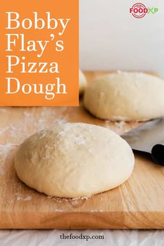 two pizza doughs sitting on top of a wooden cutting board