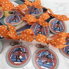 orange and white polka dot ribbon with name tags attached to each one's lanyard