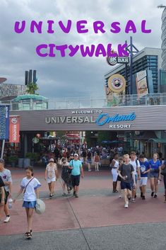 people walking in front of universal city walk