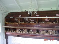 an old wooden shelf filled with lots of hay and other things on top of it