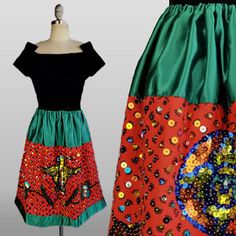 ~1970s China Poblana Mexican folk skirt  ~Green satin yoke and border at hem of skirt ~Waistband has a lot of stretch and can fit a broad range of sizes ~Red flannel panel between green satin yoke and border is covered in multi-colored sequins  ~Each sequin is bolstered by a clear seed bead ~Sequins come together to form the classic images on these skirts of an eagle with rattlesnake (found on the Mexican flag), flowers and a large Aztec medallion  This example is a fun short version of the typi Folklorico Skirt, Aztec Medallion, Folk Skirt, Mexican Skirt, Skirt Waistband, Sequined Skirt, Mexican Flag, Mexican Flags, Red Flannel