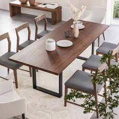 a dining room table with chairs around it