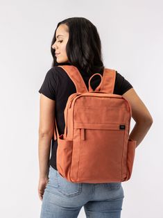 Need a backpack that's both sustainable and practical for college, school everyday use or outdoor activities? Our Earth Backpack is perfect for you. Our spacious and durable Earth Backpack is the workhorse of our line, built for everyday carry with heavy-duty certified organic cotton canvas. The generous main compartment is divided with a no-fuss sleeve for your laptop and one small interior pocket to keep things organized. Two water bottle sleeves and the large zippered exterior pocket keep hyd Versatile Canvas Backpack For School, Versatile Canvas School Backpack, Cotton Backpack With Adjustable Straps For Daily Use, Daily Use Cotton Backpack With Adjustable Straps, Everyday Canvas Backpack With Functional Pockets, Everyday Rectangular Backpack For Back To School, Functional Pockets Softback Backpack, Commuting Backpack With Pockets, Everyday Back To School Rectangular Backpack