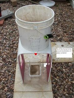 a white bucket sitting on top of a cement slab next to a red and green marker