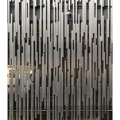 an abstractly designed metal screen is shown