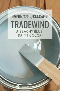 a close up of a paint can with the words tradewind painted on it in white