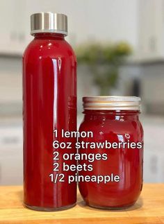 a red mason jar with instructions for how to make lemon strawberrys and orange juice