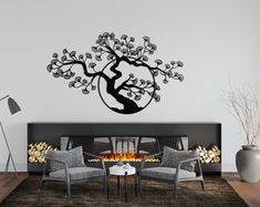 a living room filled with furniture and a fire place in front of a wall mounted tree