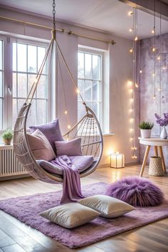 a living room with a hammock hanging from the ceiling and pillows on the floor