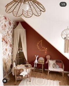 a baby's room decorated in pink and white