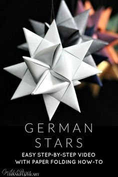 an origami star hanging from the ceiling with text overlay that reads german stars easy step - by - step video with paper folding how - to