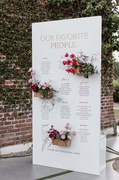 a sign with flowers on it that says our favorite people