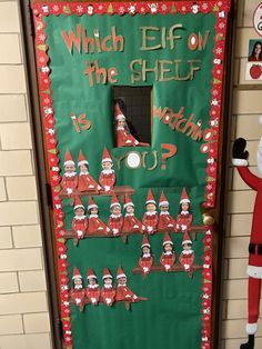 a door decorated with santa clause and elfs for the shelf is worthing up