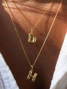 Material: High-quality, 925 Solid Sterling Silver over 14k gold plated or silver.  that ensure long-lasting wear. Chain Length: 16"+2" Elevate your style with our 3D Bubble Letters Necklace, featuring a charming hollow bubble letter initial pendant. This dainty layered necklace combines elegance and playfulness, perfect for adding a personalized touch to your outfit. Crafted with attention to detail, the balloon-inspired design offers a unique and trendy look. Ideal for everyday wear or as a thoughtful gift, this necklace highlights your initials or name with a fun, eye-catching flair. Embrace the beauty of custom jewelry with this versatile piece. Gold Initial Pendant Necklace With Letter Print, Gold Initial Necklace With Letter Print As Gift, Elegant Gold Necklaces With Letter Print, Elegant Gold Necklace With Letter Print, Birthday Initial Pendant Necklace With Clavicle Chain, Initial Pendant Necklace With Letter Print For Gift, Letter Print Initial Pendant Necklace As Gift, Gift Letter Print Initial Pendant Necklace, Balloon Necklace