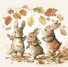 three bunnies are standing in the leaves and one is holding onto another bunny's leg