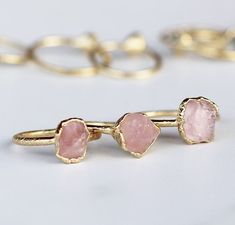 A tiny raw rose quartz crystal is picked with intention and set on a delicate gold band with an organic style setting. ⭐️  Each ring is made by hand and finished with an ultra heavy, nickel free 14k gold plate. Our 14k gold plate is 20 times thicker than most commercial jewelry and intended to last. Stones are about 1/3 inch in size. Please keep in mind that they are natural, so will vary in exact shape, color and size. No two are alike, but all are equally beautiful.Every item purchased arrives Rose Quartz Ring Aesthetic, Rose Quartz Gold Ring, Rose Quartz Wedding Ring, Raw Rose Quartz Ring, Rose Quartz Rings, Rose Quartz Engagement Ring, Rose Quartz Wedding, Crystals Rose Quartz, Rose Quartz Ring Engagement