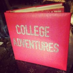 a red book with the words college adventures written on it sitting on top of a table