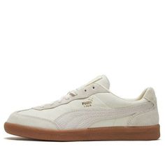 The PUMA Liga Leather Shoe Beige is a classic sneaker with a modern twist. Crafted from premium materials, the silhouette features a white upper with a rubber sole for a comfortable and stylish feel. Perfect for everyday wear, this sneaker is inspired by the classic Liga series and will keep you looking stylish no matter the occasion. With its timeless design and modern materials, this sneaker is the perfect addition to any wardrobe. (SNKR/Skate/Unisex/Low Top/Non-Slip/Wear-resistant) Cream Suede Sneakers For Streetwear, Cream Leather Sneakers With Translucent Outsole, Cream Sneakers With Rubber Sole For Light Sports, Cream High-top Sneakers With Textured Sole For Streetwear, Cream Sneakers With Vulcanized Sole For Sports, Modern Cream Sneakers For Streetwear, Cream Leather Sneakers For Streetwear, Urban Cream Low-top Sneakers, Modern Cream Sneakers For Sports