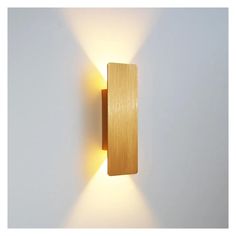 a wooden wall light on a white wall