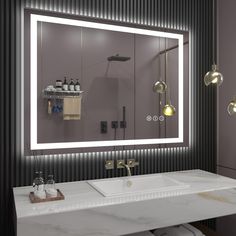 a bathroom with a sink, mirror and lights on the wall above it's counter