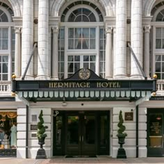 the front entrance to an ornate hotel