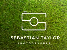 the logo for sebastian taylor photography, which is on display in front of green grass